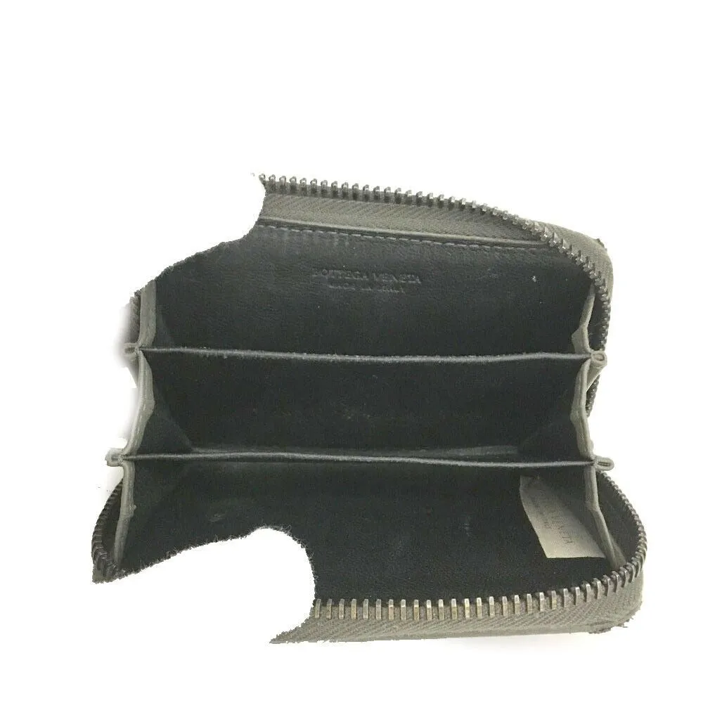 Bottega Veneta, grey intrecciato leather wallet with three compartments and a zip around style!